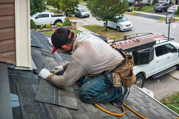 Professional Storm Damage Roof Repair technician working in Hanceville, AL